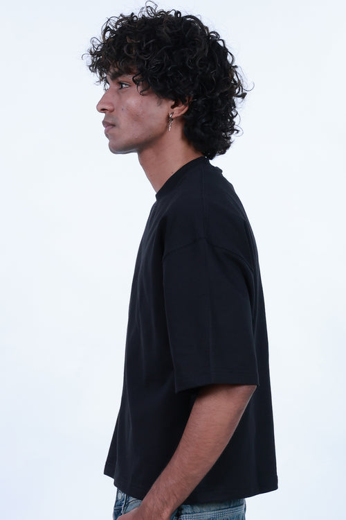MoonOne Boxy Fit T-Shirt Black - Men's Side Pose | Boxy Fit Cotton Tee
